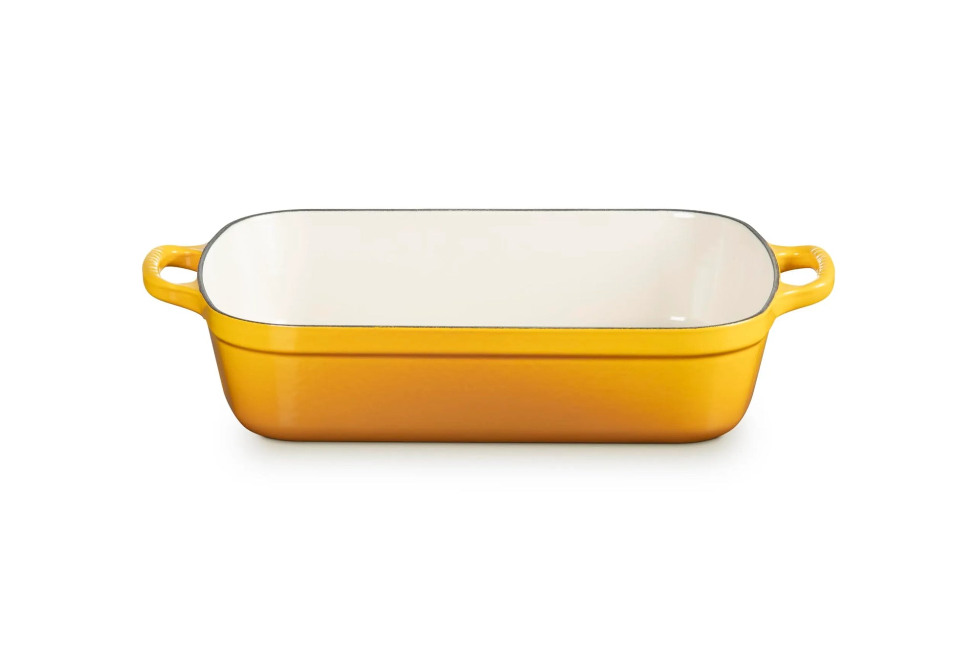 A rectangular yellow enameled baking dish with two side handles and a white interior, shown on a clean white background.