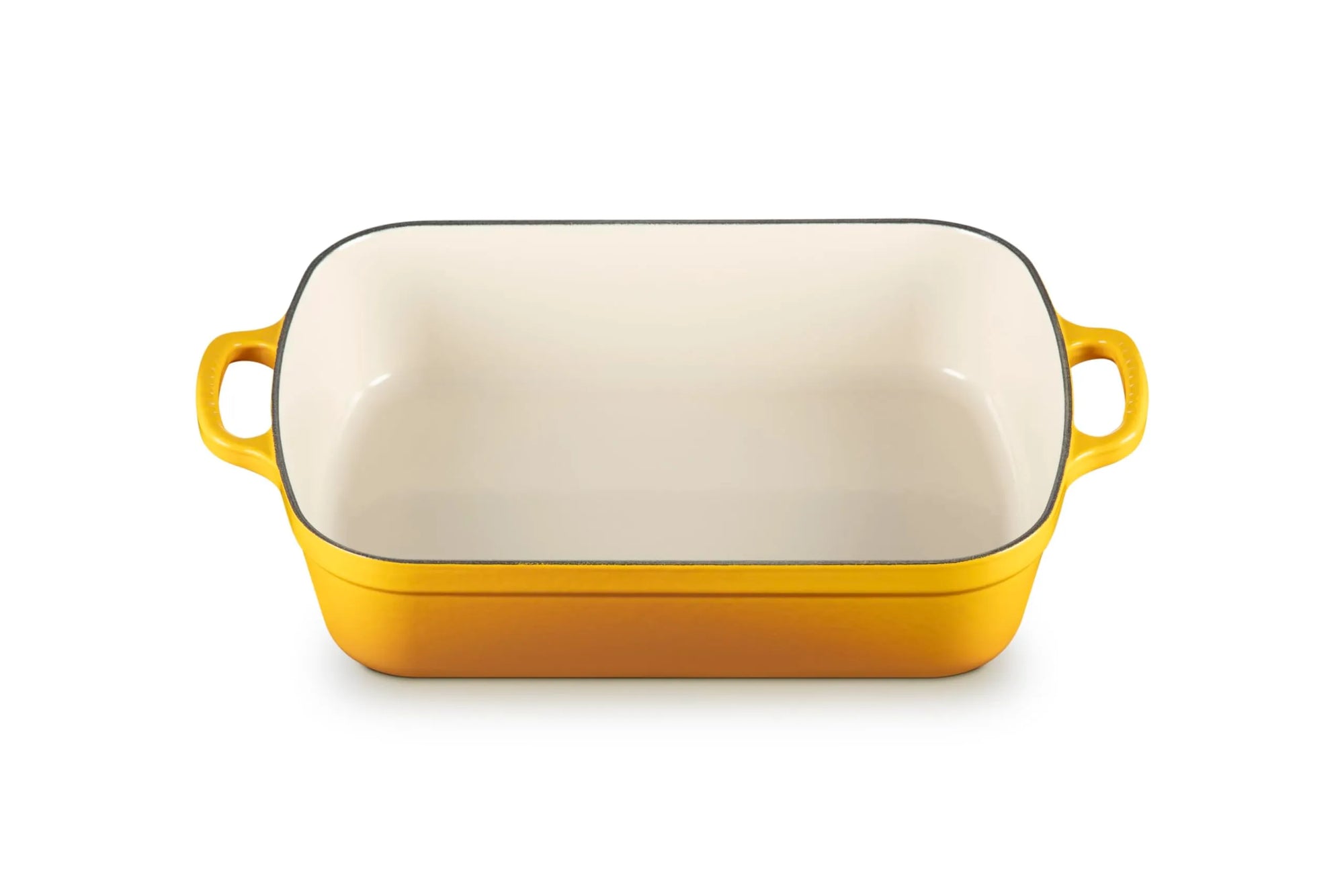 A rectangular yellow enameled baking dish with a cream-colored interior and two yellow side handles, shown on a plain white background.