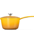 A yellow enameled saucepan with a matching lid and long handle, shown on a clean white background.