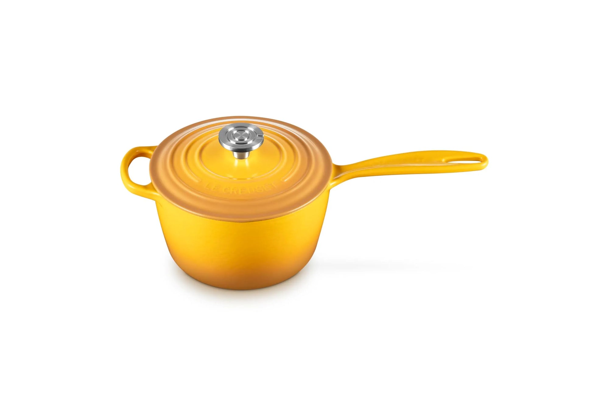 A bright yellow enameled cast iron saucepan with a matching lid and a silver knob, shown on a clean white background.