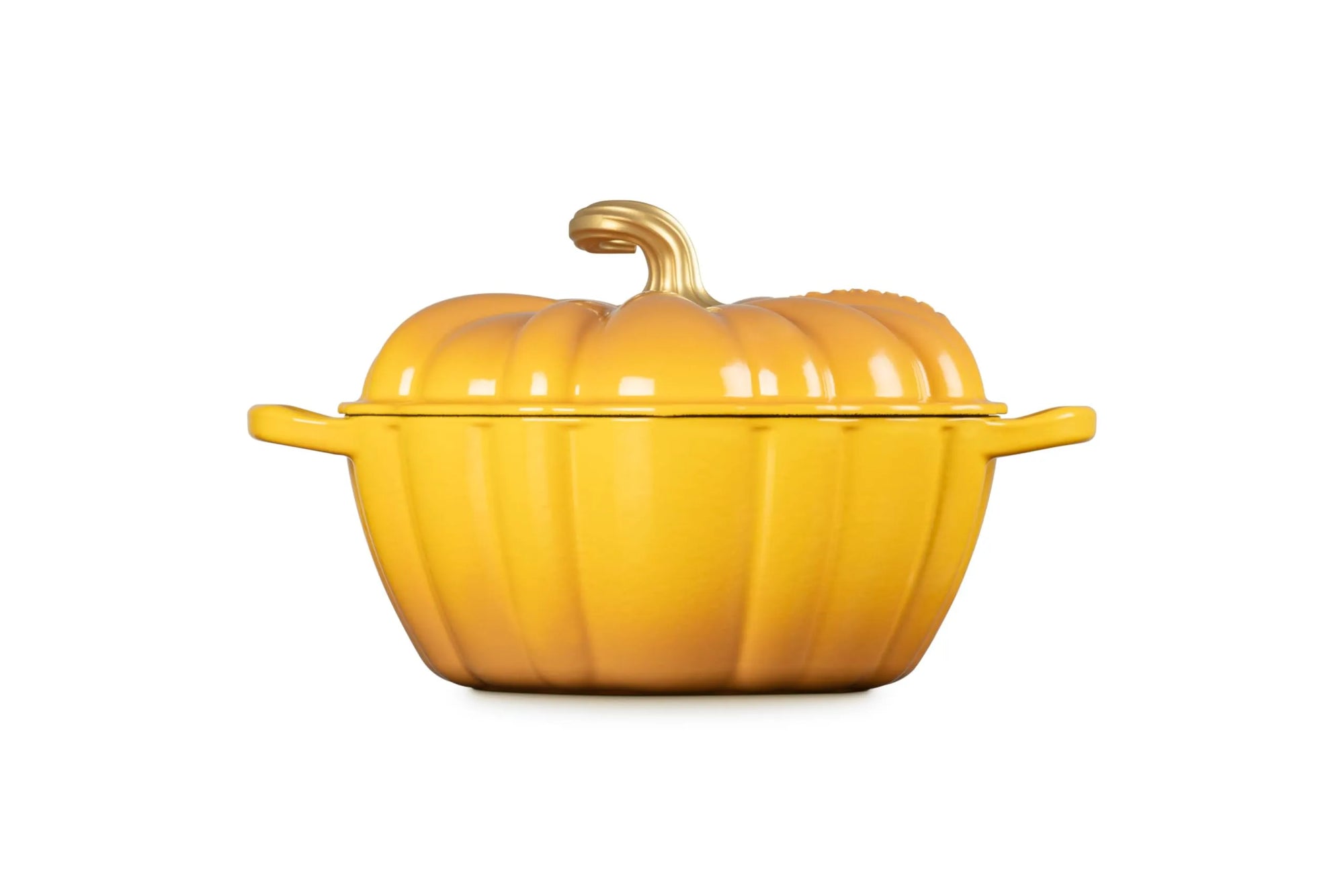 A yellow pumpkin-shaped enameled cast iron Dutch oven with a matching lid and small side handles, shown on a plain white background.