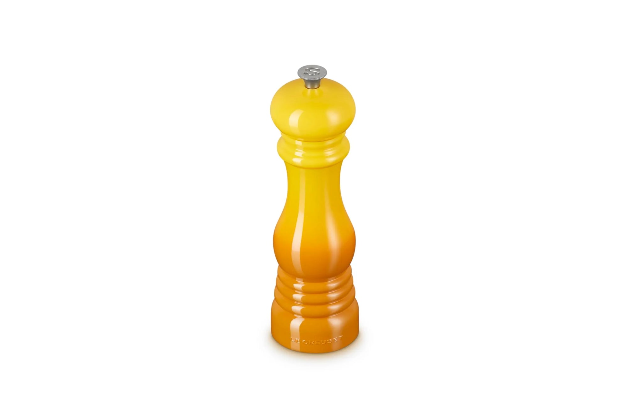 A yellow to orange gradient pepper mill with a silver metal top, centered on a plain white background.