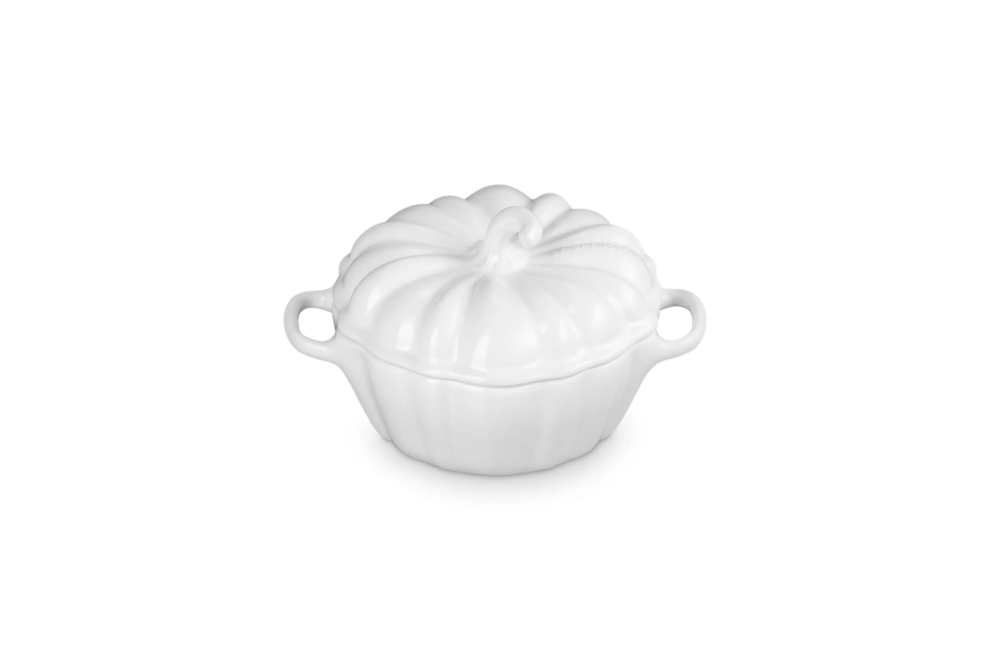 A white cast iron pumpkin-shaped lidded cocotte dish with side handles, shown on a solid white background.