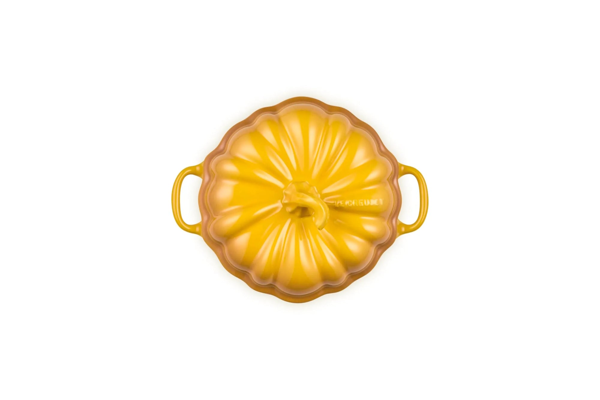 A yellow enameled cast iron Dutch oven with a pumpkin-shaped design and two side handles, shown from a top-down view on a white background.