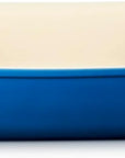 Rectangular ceramic baking dish with handles in blue and beige
