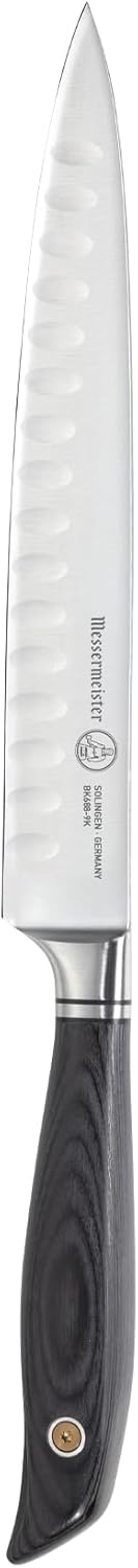 Carving knife with a black handle on a white background