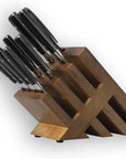Set of knives in a wooden block on a white background