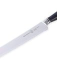 Bread knife with a black handle on a white background