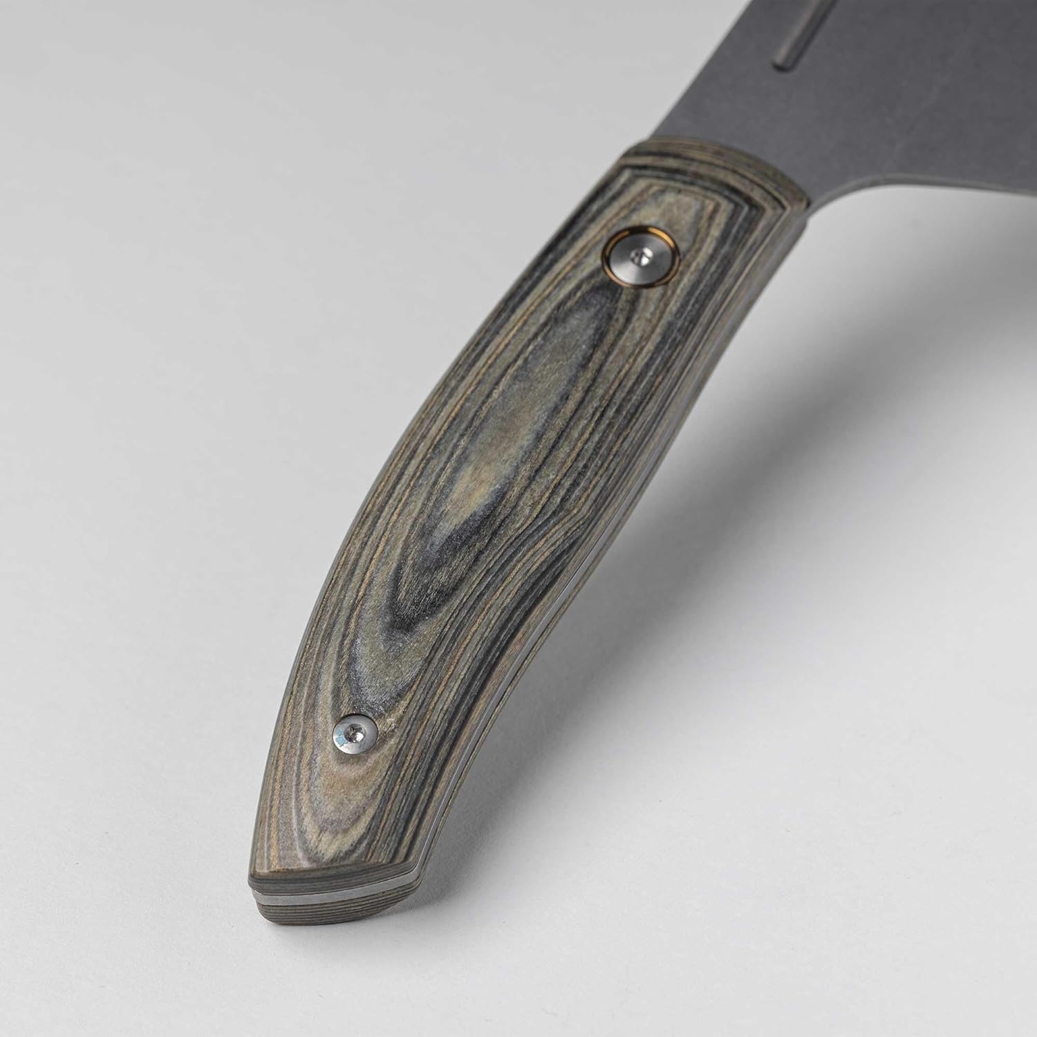 Close-up of a knife with a wooden handle on a light gray background