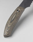 Close-up of a knife with a wooden handle on a light gray background