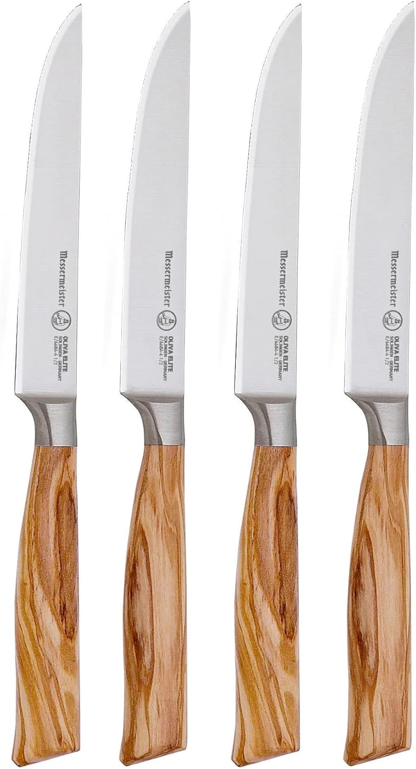 Set of four knives with wooden handles on a white background