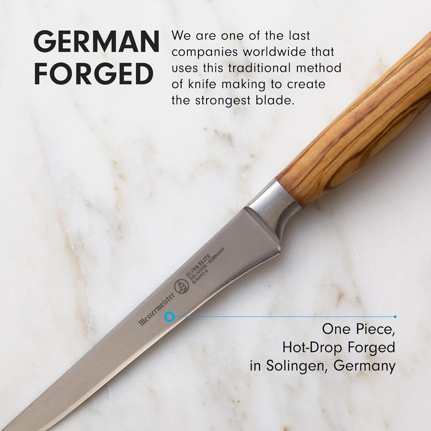 Knife with wooden handle on a marble surface, highlighting German forging process.