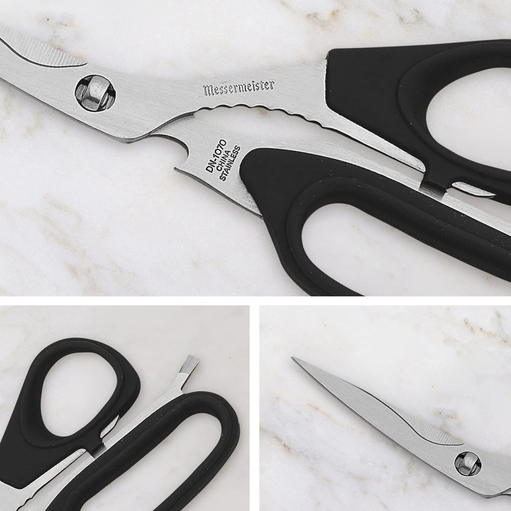 Pair of scissors with black handles on a marble surface, featuring the brand 'Messermeister'.