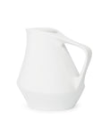White ceramic pitcher on a white background