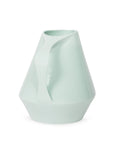 Side view of sage green ceramic pitcher on a white background