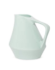 Sage green ceramic pitcher on a white background