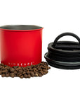 Red container with black lid and coffee beans on a white background, featuring the 'AIRSCAPE' brand.