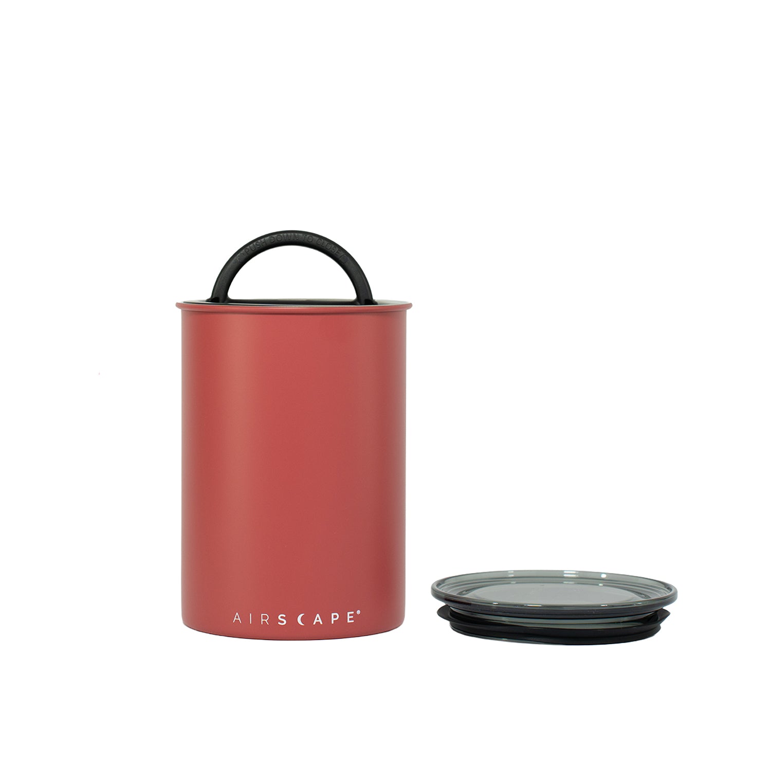 Red container with black lid on a white background