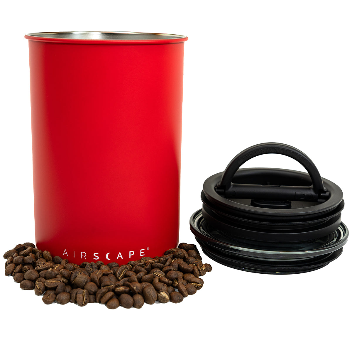 Red air tight container with black lid and coffee beans on a white background
