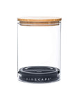Empty glass airscape jar with both the airtight lid and bamboo lid on a white background