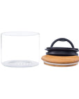 Empty medium glass airscape container with airtight lid and bamboo lid on a white background