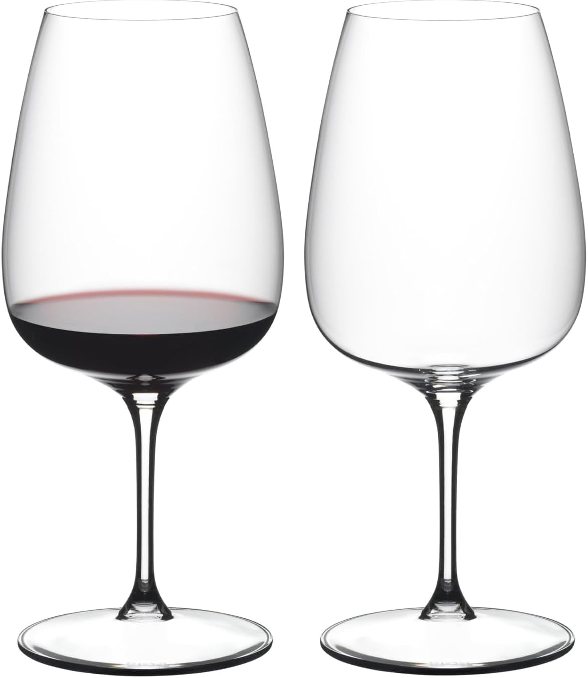 Two wine glasses, one filled with red wine, on a white background