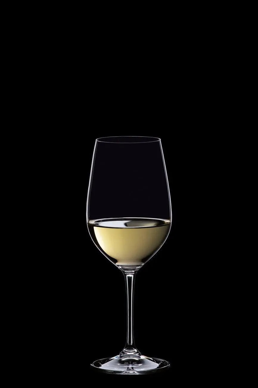 Glass of white wine on a black background
