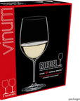 Boxed wine glass set shown at an angle, featuring a large black front panel with a clear stemmed wine glass filled with white wine and red side panels. Visible text includes 'vinum', 'RIEDEL THE WINE GLASE COMPANY', and 'GRAPE VARIETAL SPECIFIC'.