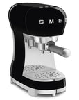 Black Smeg espresso machine on a white background