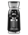 Front view of Black coffee grinder with glass container on a white background