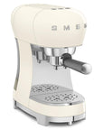Cream-colored espresso machine with 'SMEG' logo on a white background