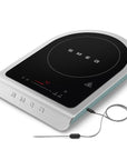 Portable induction cooktop with SMEG branding on a white background