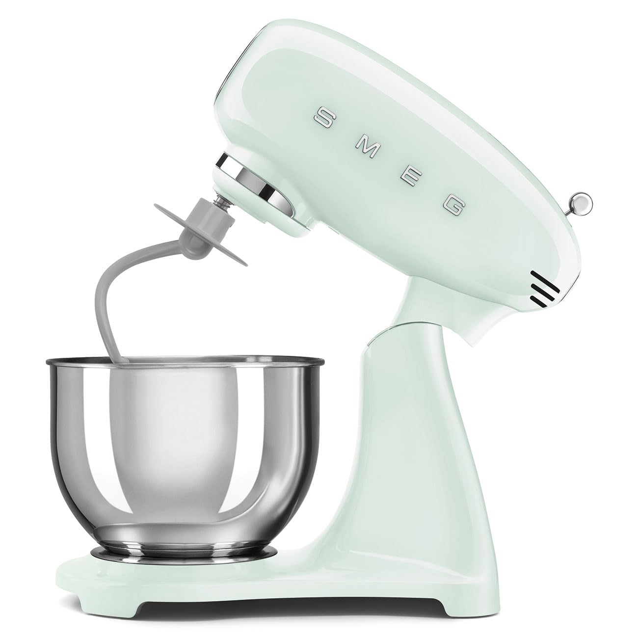 Light green stand mixer slanted open with a mixing bowl on a white background