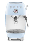 Front view of pastel blue SMEG espresso machine on a white background