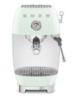 Front view of pastel green espresso machine with Smeg logo on a white background