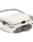 Back view of cream Smeg grill with silver accents on a white background
