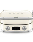 Front view of cream Smeg grill with silver accents on a white background