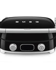 Front view of black Smeg grill with silver accents on a white background