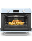 Pastel blue Smeg retro line countertop air fry oven with door open with food on a clear container on a white background