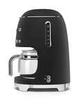 Side view of matte black Smeg coffee machine on a white background