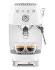 White SMEG espresso machine with two cups of coffee on a white background