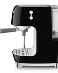 Side view of black SMEG espresso machine on a white background