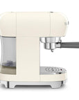 Side view of Smeg Cream-colored espresso machine with a clear water tank on a white background