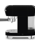 Side view of black espresso machine with silver accents on a white background