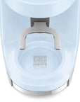Close-up of a coffee grinder with a QR code label on a white background