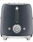 Side view of dark gray toaster with silver accents and a control dial on a white background