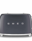 Front view of dark gray Smeg toaster on a white background