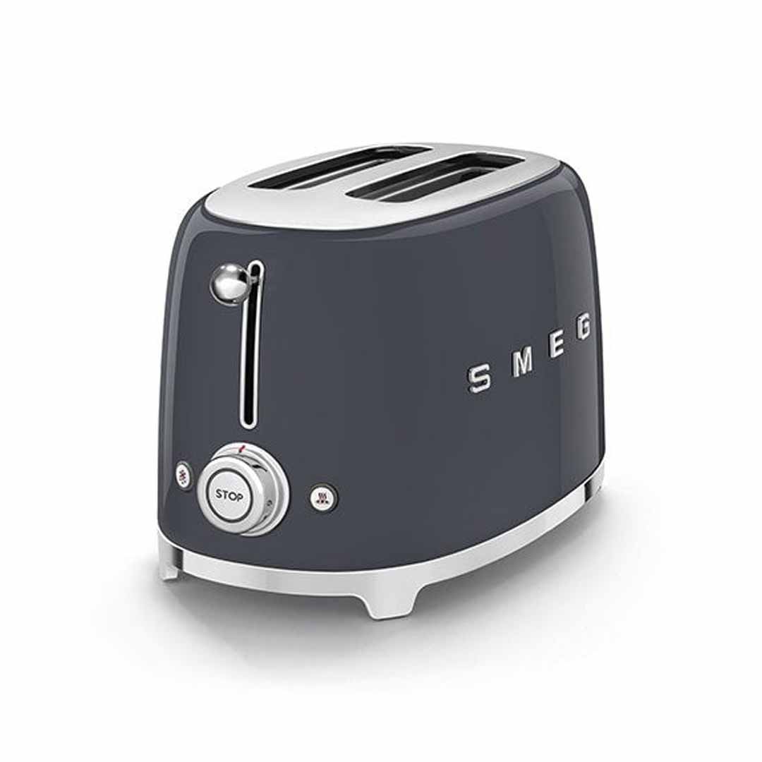 Dark gray Smeg toaster with silver accents on a white background