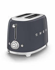 Dark gray Smeg toaster with silver accents on a white background