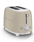 Matte beige toaster with 'Smeg' branding on a white background